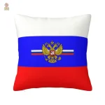 Coussin blanc orné d'un aigle doré et drapeau