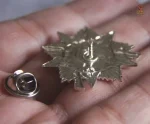 Insigne argenté 2ème classe, symbole de l'Ordre de la Guerre